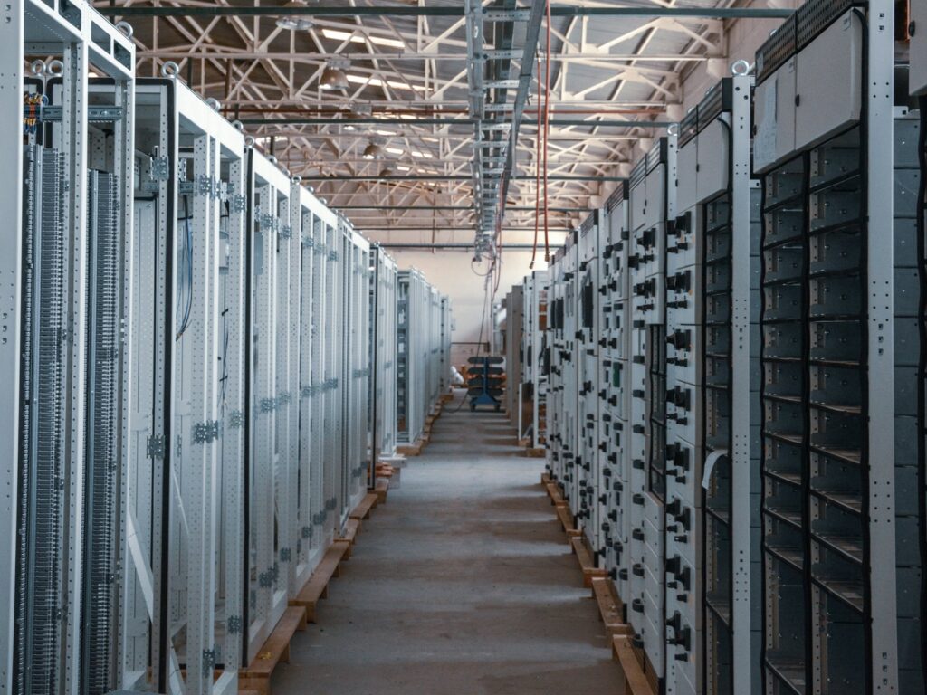 Data center aisle lined with equipment racks