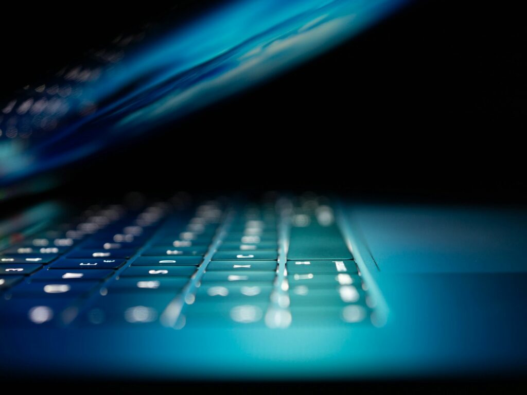 Close-up of a laptop screen in blue light