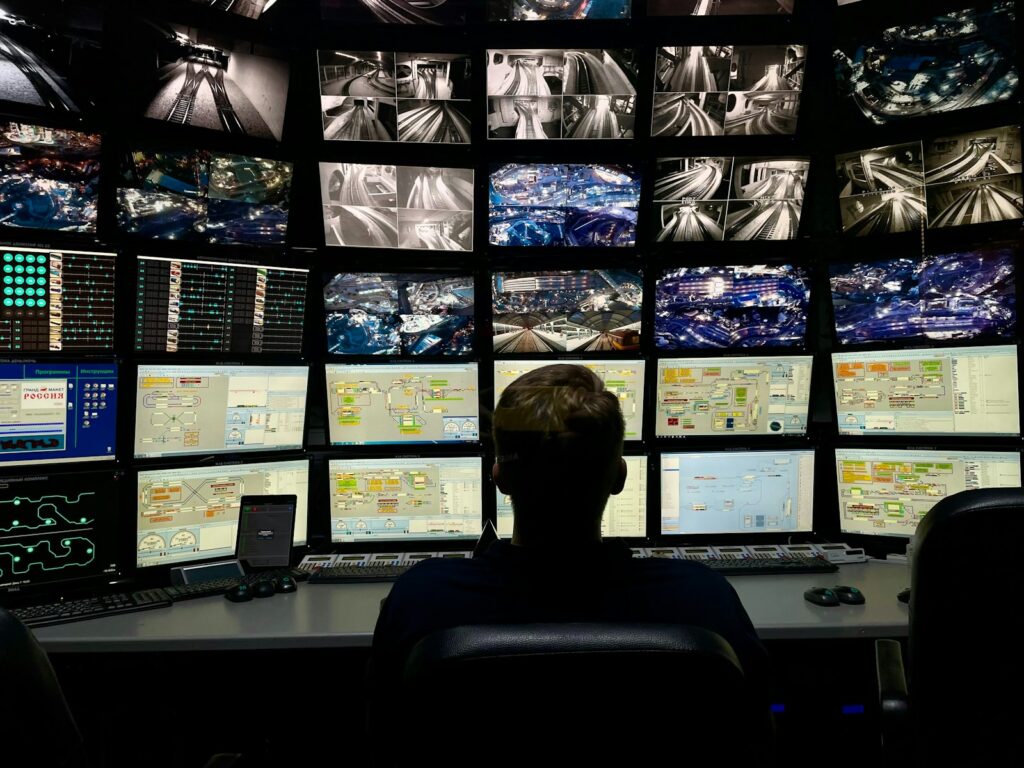 Analyst working in front of multiple monitors